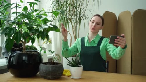 Woman Vlogging about Plants on Cell Phone Indoors