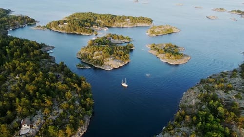 Scenic Drone Footage Of Small Islands And Blue Sea, Serene Coastal Escape Sunset