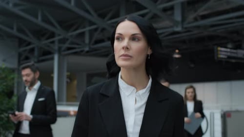 Businesswoman walking confidently at corporate conference or political summit