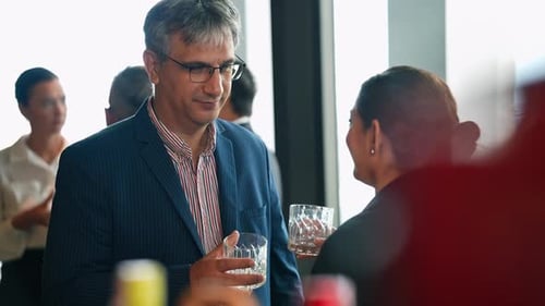 Colleagues Chatting with Drinks at Corporate Networking Event