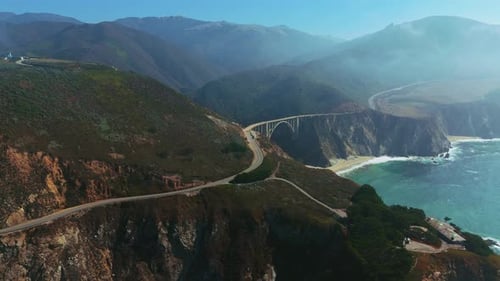Bixby Bridge at Big Sur, Highway One in California with fog. Aerial of famous road.