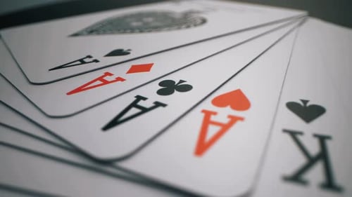 Playing Cards Spread on Dark Table - Close-Up Shot