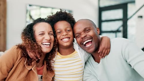 Joyful Family Laughing Together in Home Close-up