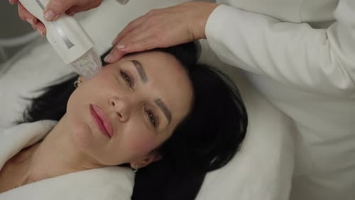 Closeup Top View of Professional Dermatologist Performing Radiofrequency Microneedling Treatment on