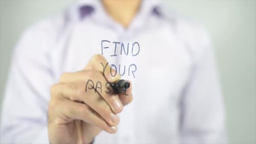 Man Writes Find Your Passion on Clear Surface