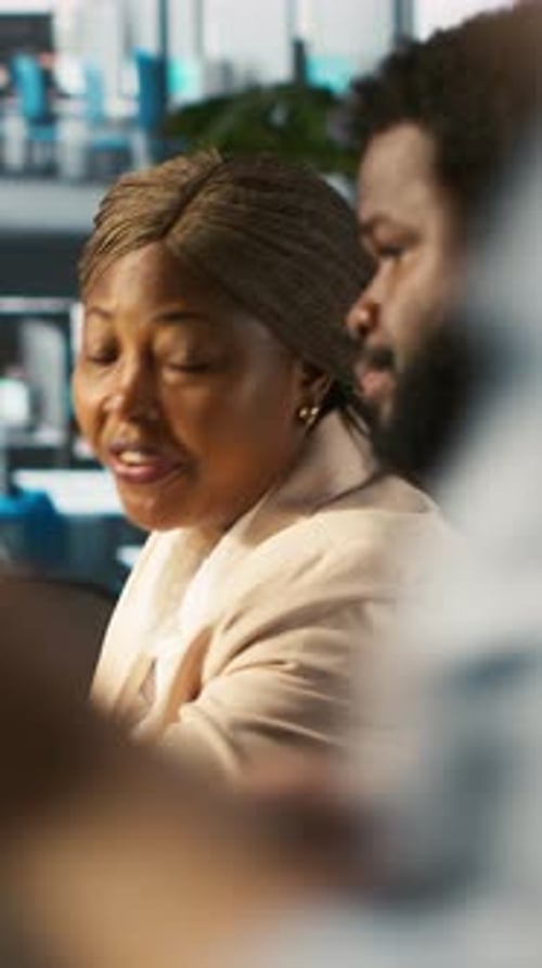 Vertical Video Supervisor in Office Discussing with Employee About Key Performance Indicators