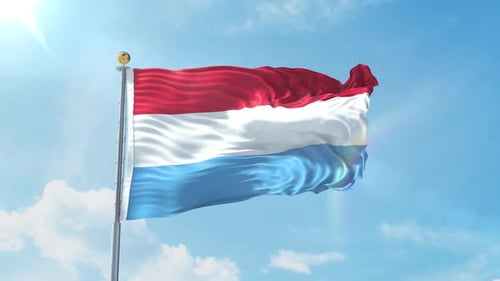 Luxembourg National Flag Waving in Blue Sky