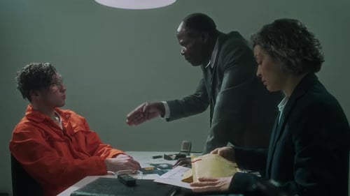 Tense Interrogation Scene with Prisoner and Investigators