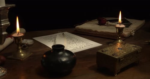 Candle Lit Vintage Desk With Letter and Quill