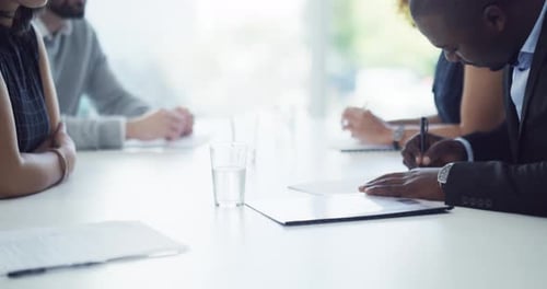 4k video footage of businesspeople signing paperwork and shaking hands in an office