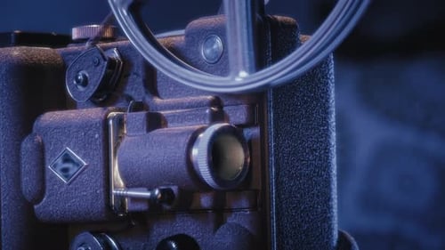CloseUp Of Vintage 8Mm Projector Playing Home Film In The Dark