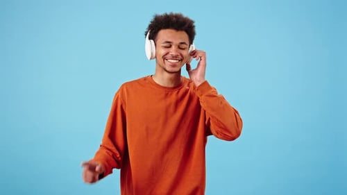 Young Adult Enjoying Music with Headphones