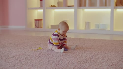 Baby Plays with Toy at Home