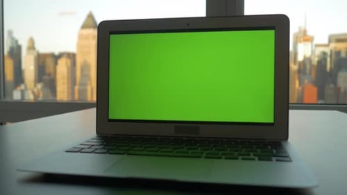 Computer Screen Isolated on GreenScreen Background Chroma Key in City Office