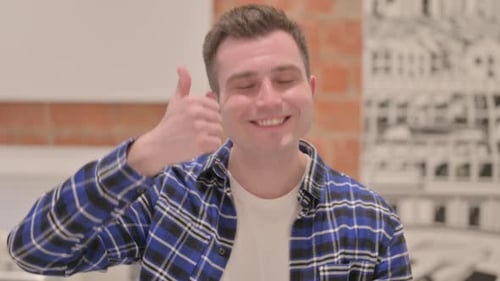 Young Man Giving Thumbs Up