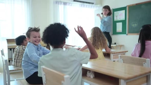 Enthusiastic Teacher with Diverse Students in Classroom