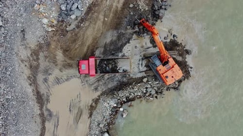 Truck Engineering Coastal Barrier Aerial. Coastal Barrier Building Process