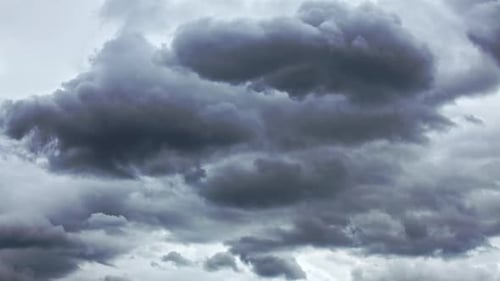Dramatic Gray Cumulus Clouds Moving Slowly in Sky