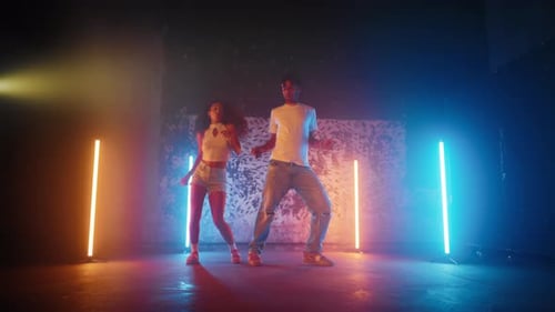 Male Dance Teacher and Female Student Dancing Together in Dance Studio Portrait African American