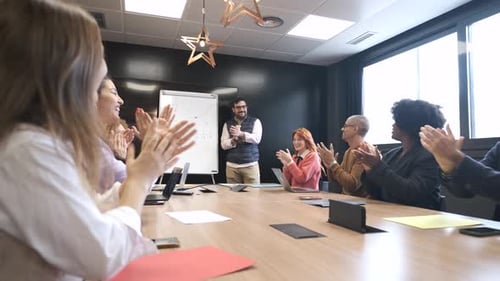 Colleagues Clapping After Presentation in a Modern Office