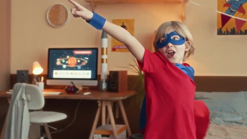 Blonde Child Posing in a Superhero Costume