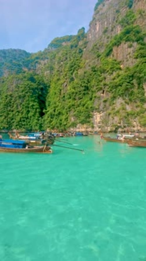 Longtail Boats and Green Blue Turqouse Lagoon at Pileh Lagoon Tropical Island Koh Phi Phi Thailand