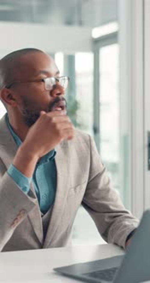 Black man, laptop and thinking at office with decision, insight and typing with article at media