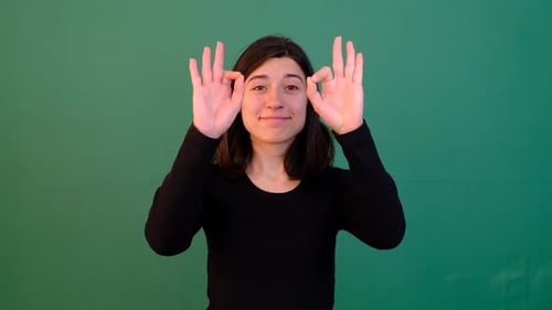 Woman Gesturing Okay Sign on Green Screen