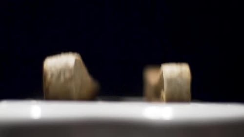 Slow motion close up shot of toast pooping up out the toaster