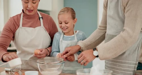 Family Baking Together in Kitchen at Home