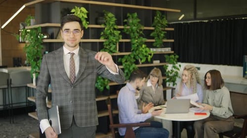 Young Adult in Suit at Modern Office Meeting