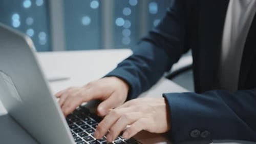 Close Up Hands Asian IT Developer Administrator Wearing Headset Speaker Using Typing on Laptop