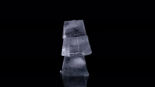 Ice Cubes Stacked on Black Reflective Surface