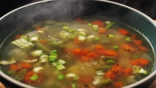 Homemade Chicken Vegetable Soup Cooking Close Up View of Chef Cooking Vegan Healthy Soup in Big Pan