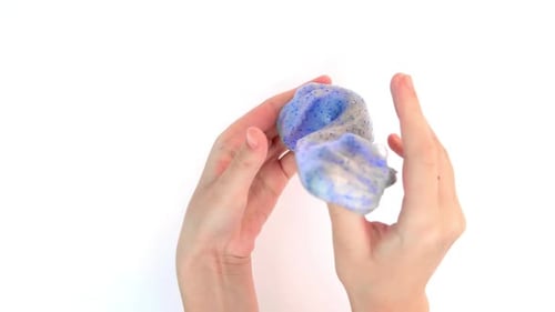 Playing with Textured Slime with Bubbles Stretching the Gooey Substance