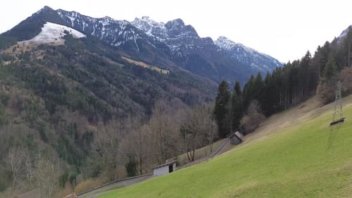 Aerial view of snow mountain range landscape in Europe Austria 4k winter drone footage