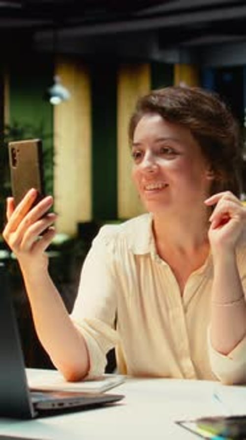 Vertical Video Businesswoman in the Office Engages in Communication During Virtual Presentation