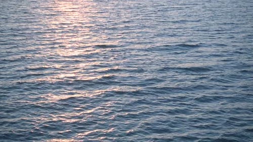 Beautiful Ocean Surface in Sunlight Over Horizon
