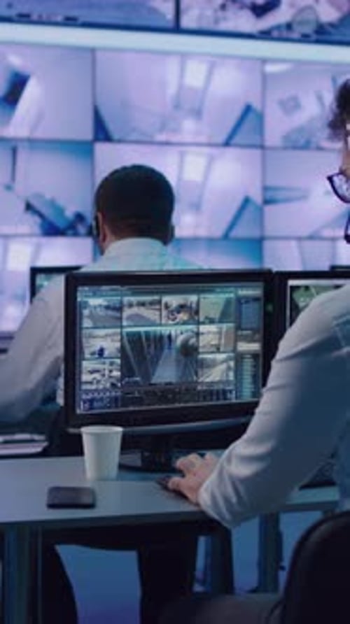 Surveillance Team Working Near Talking Bosses