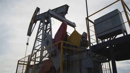 Operating Pump Jack Extracts Natural Oil From Well