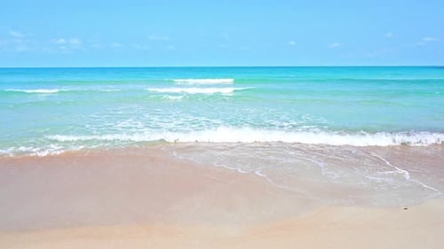 Turquoise Sea Waves Breaking on White Sand of Tropical Beach, Slow Motion