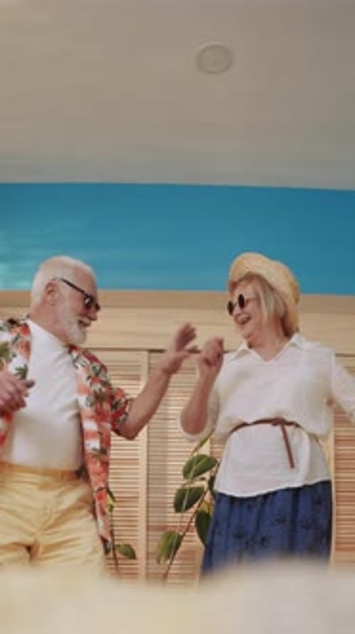 Senior Couple Lovingly Dancing Together Indoors