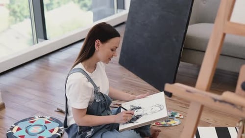 Woman Artist Drawing at Home on Canvas