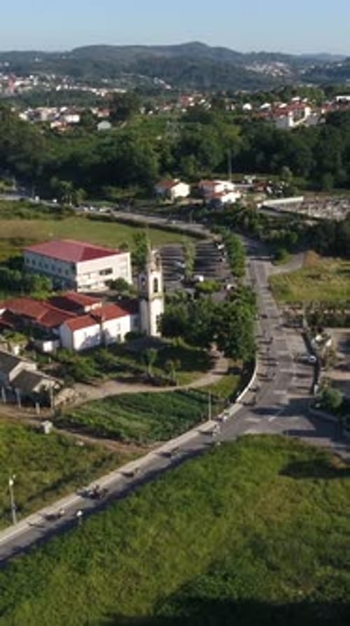 Aerial View of Church and Bikers on Road