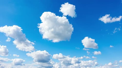 Blue Sky with White Clouds. Puffy Fluffy White Clouds Moving Fast. Cumulus Cloudscape Timelapse