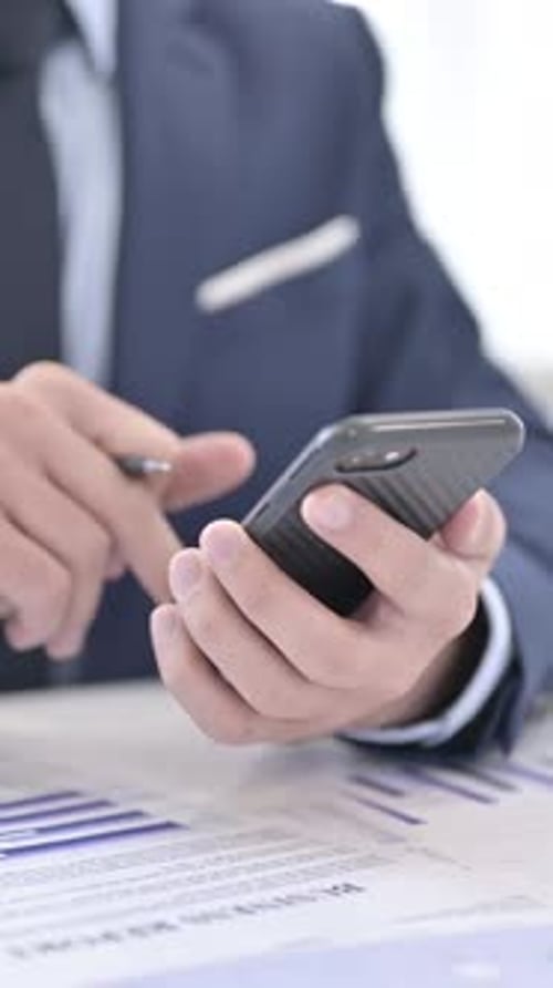 Businessman Using Smartphone, Close Up, vertical video