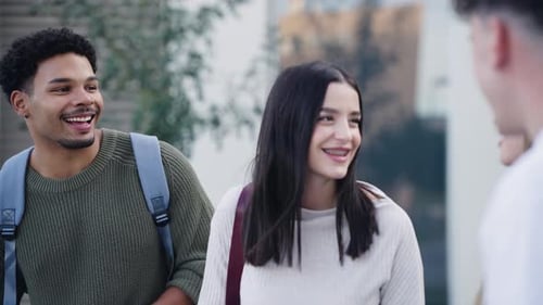 Diverse Group of College Friends Talking and Laughing Together on Campus