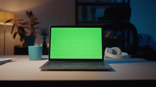 Laptop with Chroma Key Display Placing on Table in Room