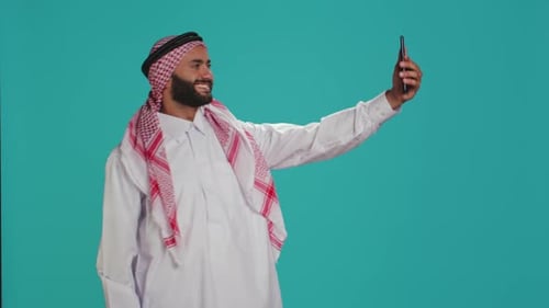 Bearded Man Taking a Selfie with Smartphone