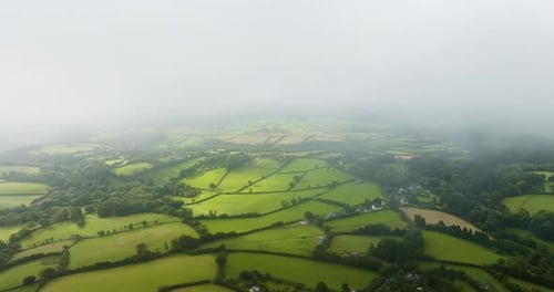 Aerial View of Rolling Green Hills and Farmlands